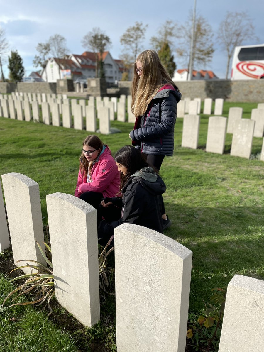 First stop on our @kingschester battlefields @HoltsTours tour: a moving visit to @CWGC Ramskapelle Rd Military Cemetery for one pupil visiting her great great grandfather, Able Seaman Ernest Alfred Hobbs DSM.