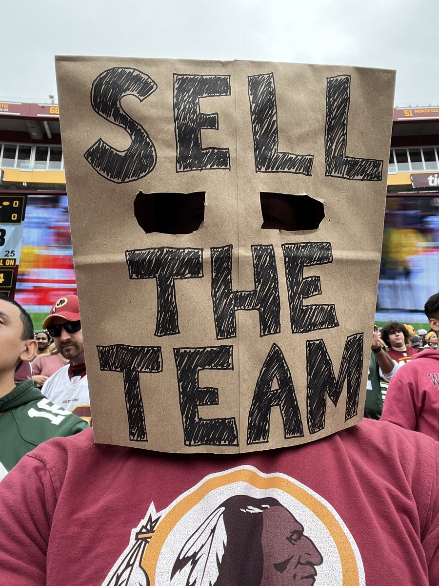 TomManatos's tweet image. Snyder’s security guards made me take the sign down so I put on the bag on and they made me take that off. I told them it was our franchise’s version of the cheese head. Plenty of cheese heads around us. #SellTheTeam