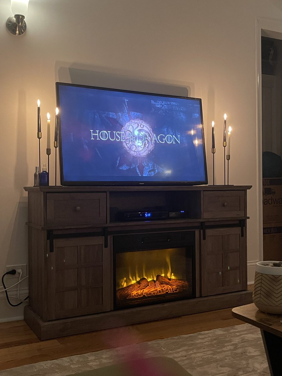 Kelly Keegs on Twitter "This tv stand/fireplace with sliding doors is probably the most