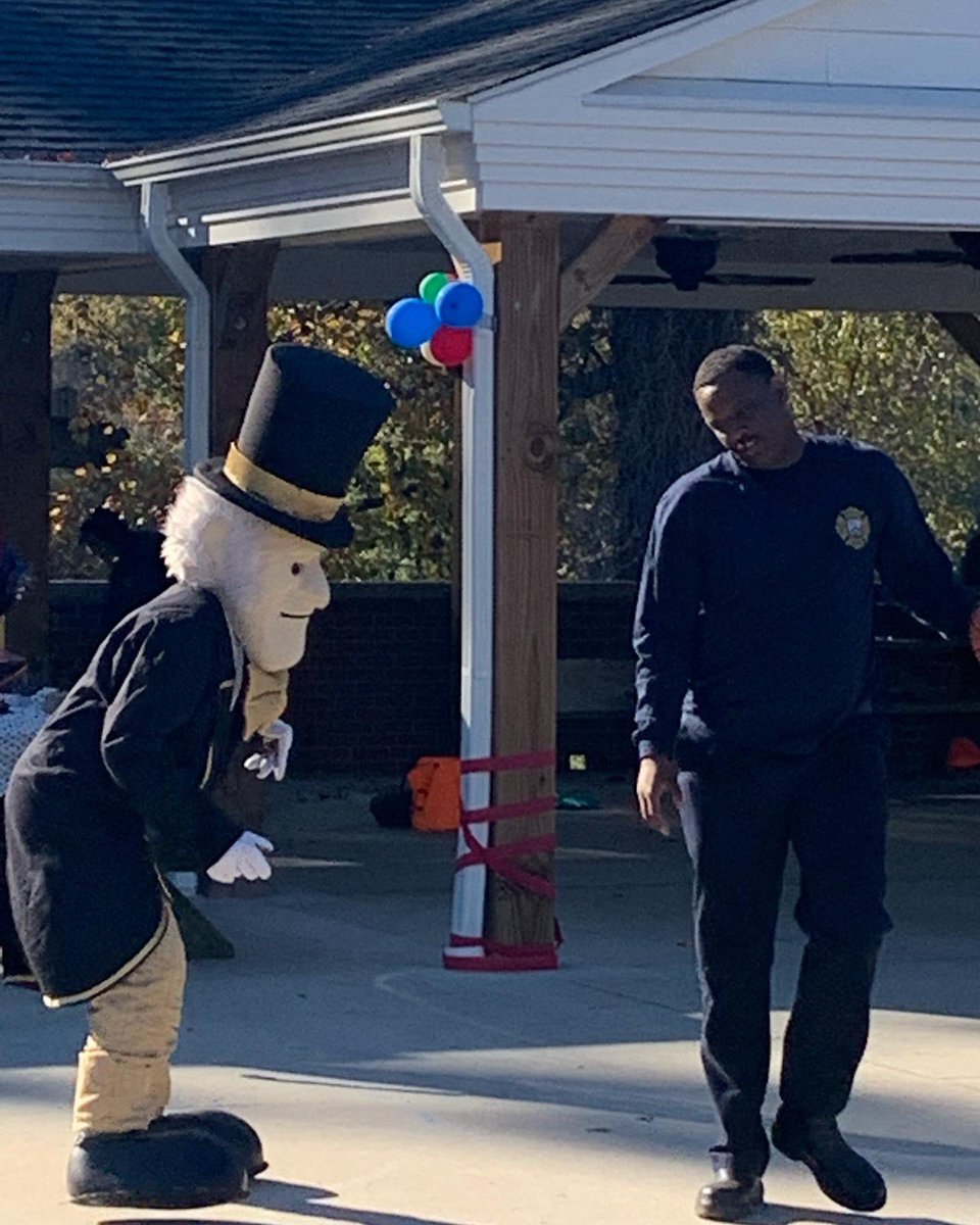 CityofWS's tweet photo. Firefighter McDaniel squared off with @WakeForest Deacon at the @CrossnoreComm Crossnore Children’s Home fall festival. #DeamonDeacon don’t want this smoke 😂🎩🚒 #PartnersInService #WSFire .107 https://t.co/sr1A8O5Beh