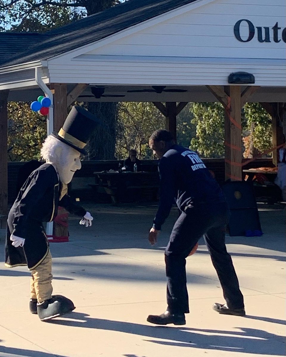 CityofWS's tweet photo. Firefighter McDaniel squared off with @WakeForest Deacon at the @CrossnoreComm Crossnore Children’s Home fall festival. #DeamonDeacon don’t want this smoke 😂🎩🚒 #PartnersInService #WSFire .107 https://t.co/sr1A8O5Beh