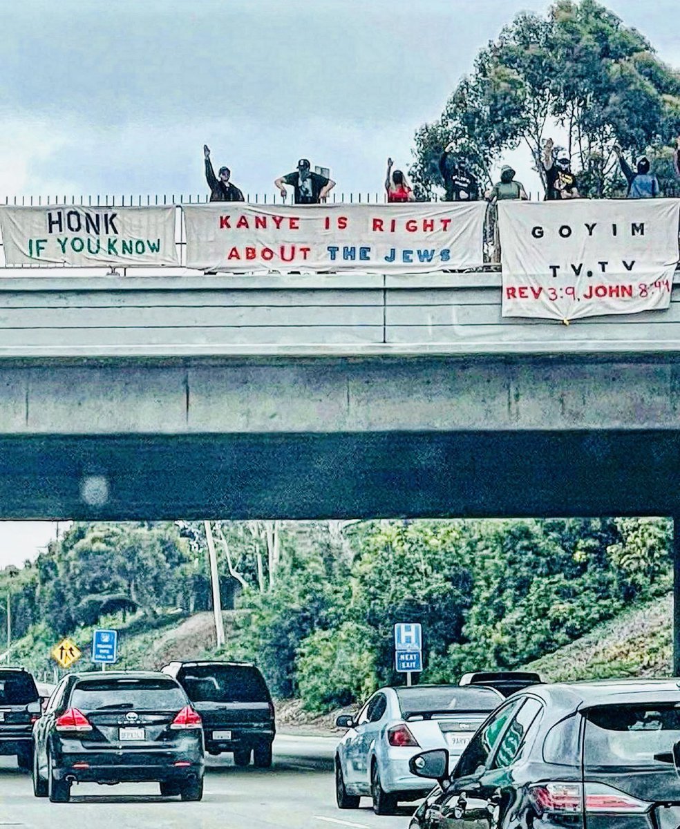 RHorchy's tweet photo. These people shouldn’t be able to do this in public. They should be terrified of getting the shit kicked out of them & thrown off that bridge #BeViolent #MakeBigotsAfraid https://t.co/8eEVwHmWNP