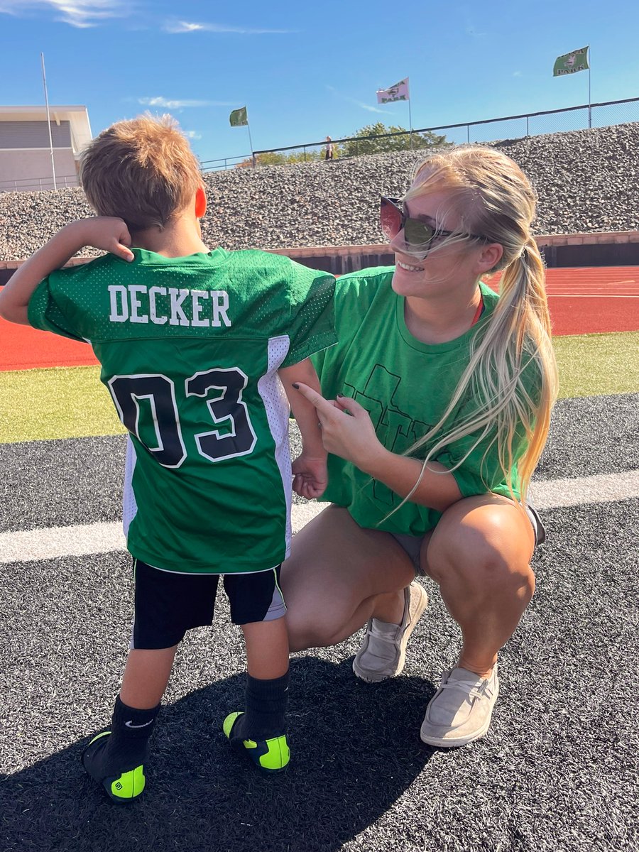 Finally got a picture with him at his last game, how is this boy already done with his 1st season! #03 is such a champ! 🥹💚🖤🏈