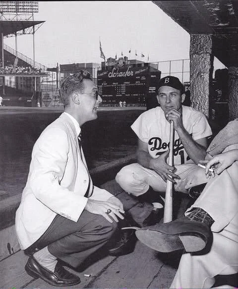 baseballinpix's tweet photo. Vin Scully talks to the Dodgers dugout at Ebbets Field, Gil Hodges to his left, early 1950s. https://t.co/HPGQpN5OOq