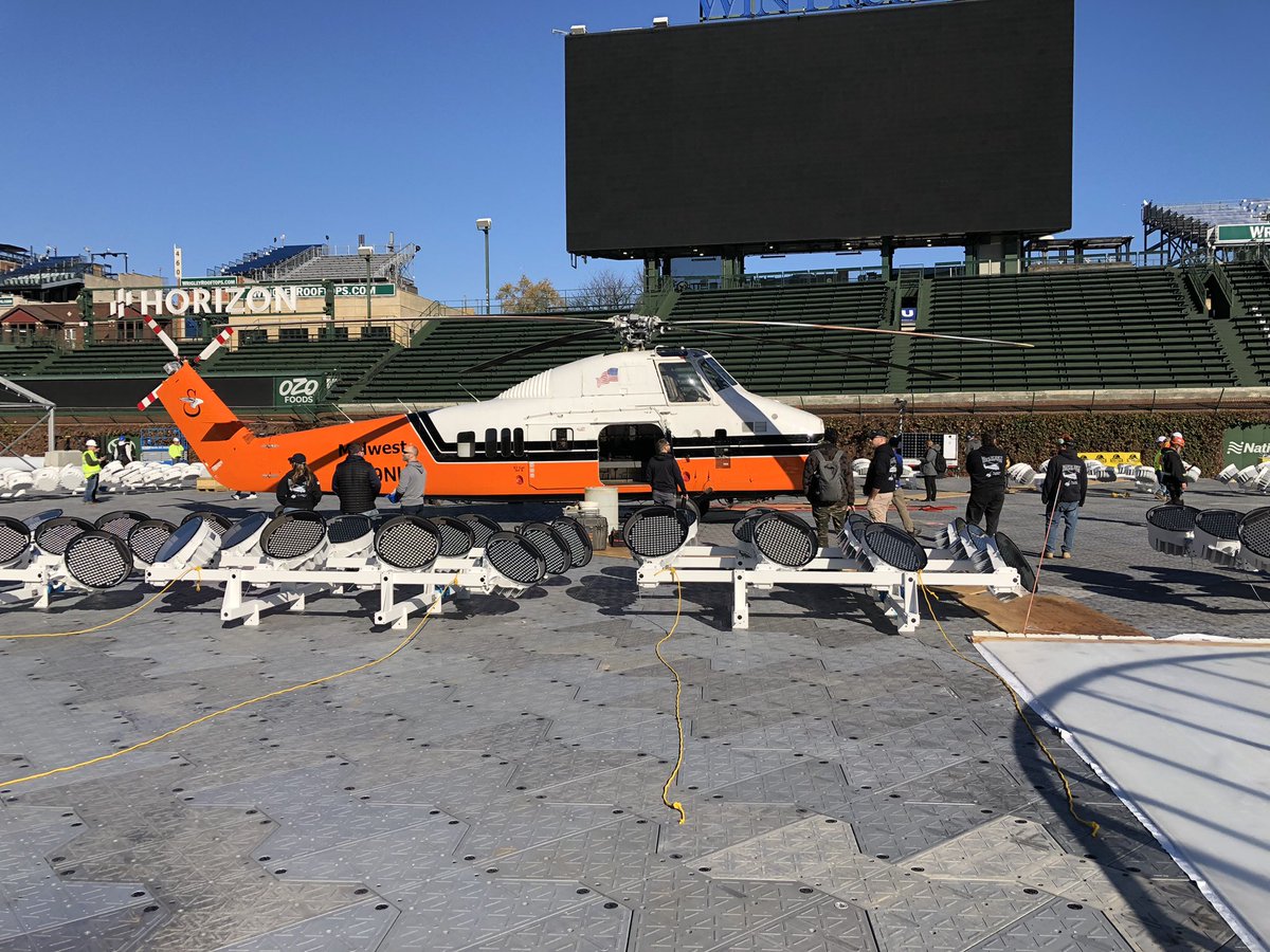 Hanging lights at Wrigley… GO MUSCO