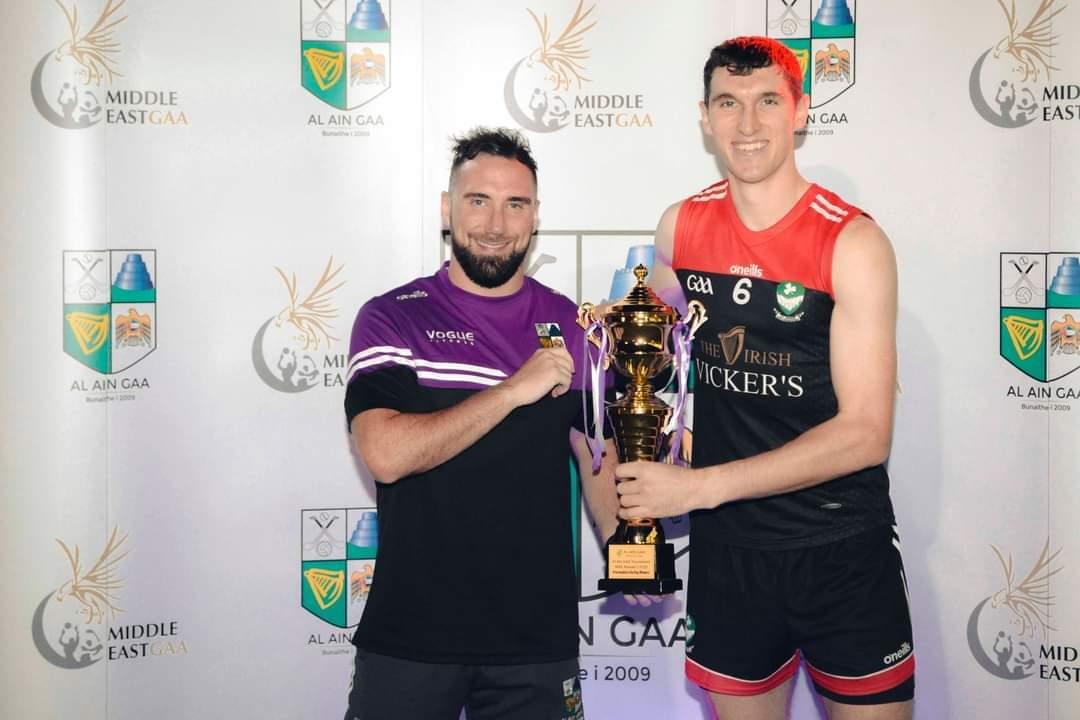 Danny Martin Carroll of Rathgarogue Cushinstown and Al Reem Shamrocks receives the winning trophy from Al Ain's Johnny Beirne after he helped his side to a massive victory in Round 2 of the 22/23 Middle East Intermediate Hurling League. #GAA #irishabroad #Hurling #wexford