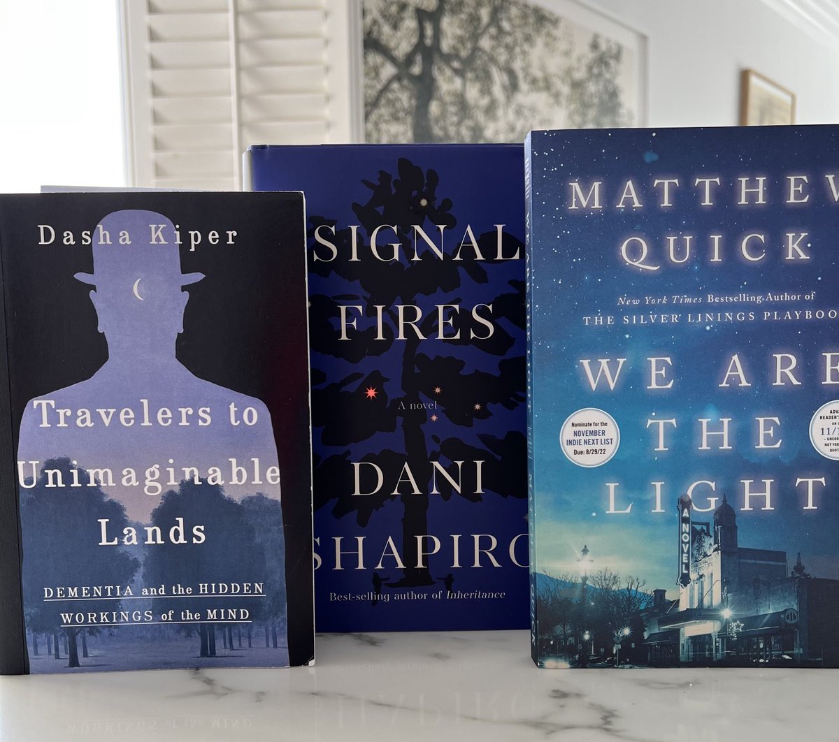 LoriGottlieb1's tweet photo. What do these 3 books have in common besides their beautiful blue covers?

A breathtaking tour of our shared humanity ❤️

Use your extra hour to curl up w⬇️

SIGNAL FIRES 🔥 by ⁦⁦@danijshapiro⁩ 
WE ARE THE LIGHT by Matthew Quick
TRAVELERS TO UNIMAGINABLE LANDS (in 2023) https://t.co/fCTbWX7gBM