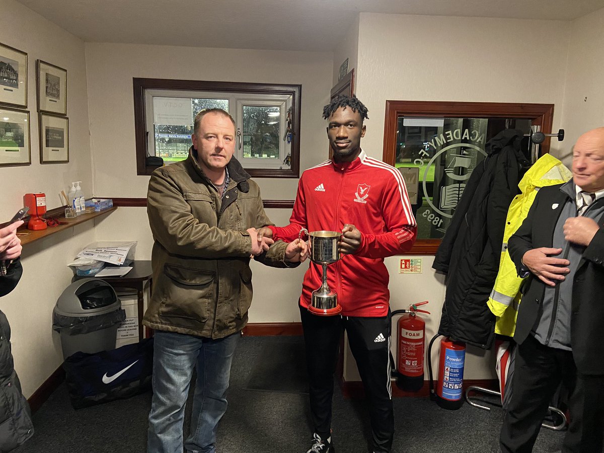 WickAcademyFC's tweet photo. Todays man of the match as chosen by the family of Hector Buttress was Deveronvale’s Horace Ormsby, Horace is pictured receiving the split loyalty trophy from Gavin Robertson. https://t.co/7QdqwzqgEa