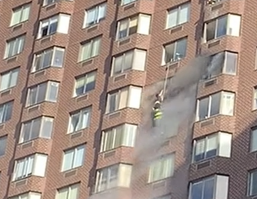 1010WINS's tweet photo. BREAKING: 38 injured in Manhattan blaze, firefighters rescue woman dangling from 15th-story window
https://t.co/vbwjDtsFG2 https://t.co/nFaNCxZ4rA