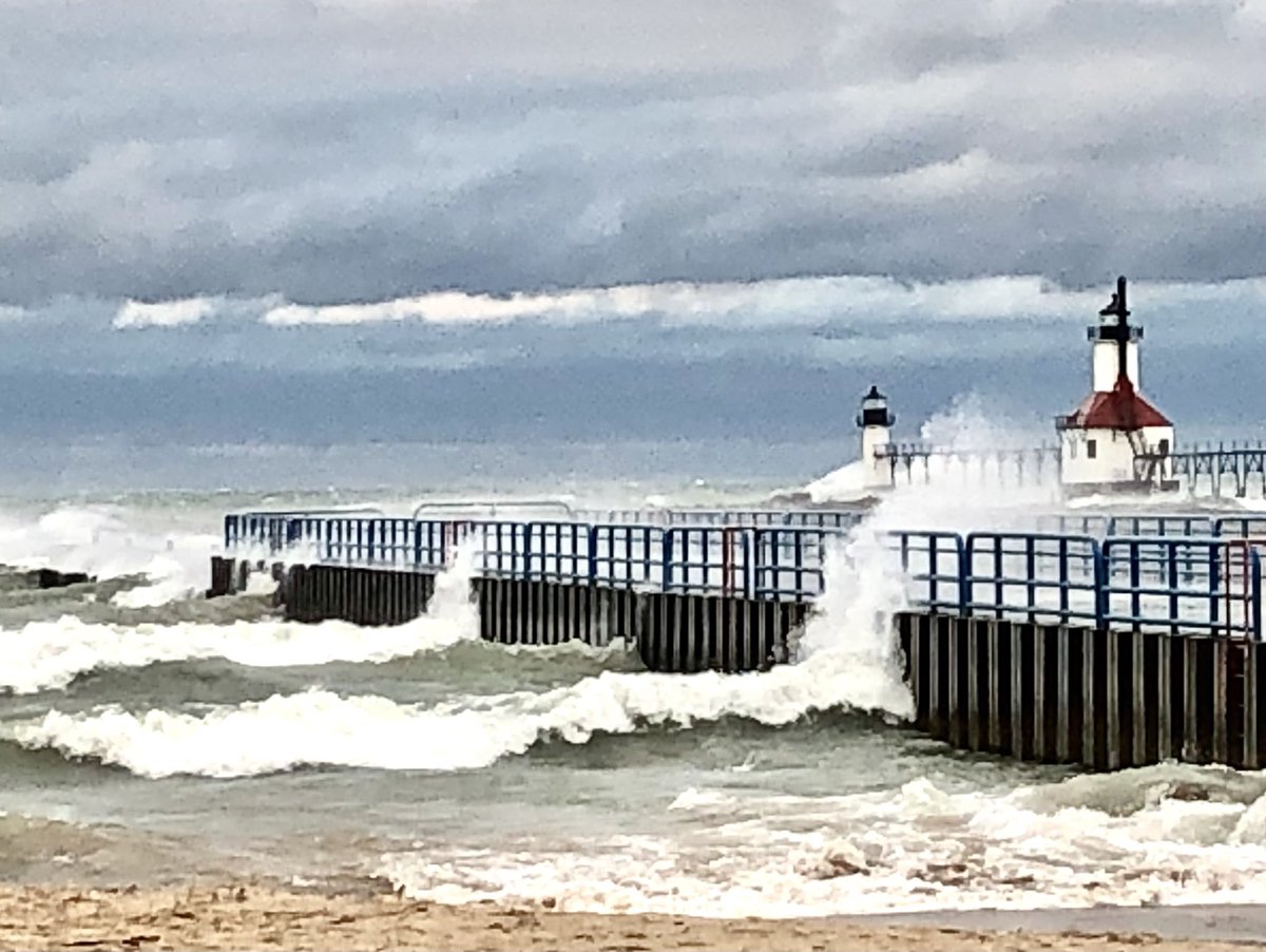 Powerful waves and wind at the pier at Silver Beach in <a href="/StJoeMichigan/">Saint Joseph</a>. #WeatherUpdate #lakemichigan #lighthouse #beach #Clouds #WAVES #surf