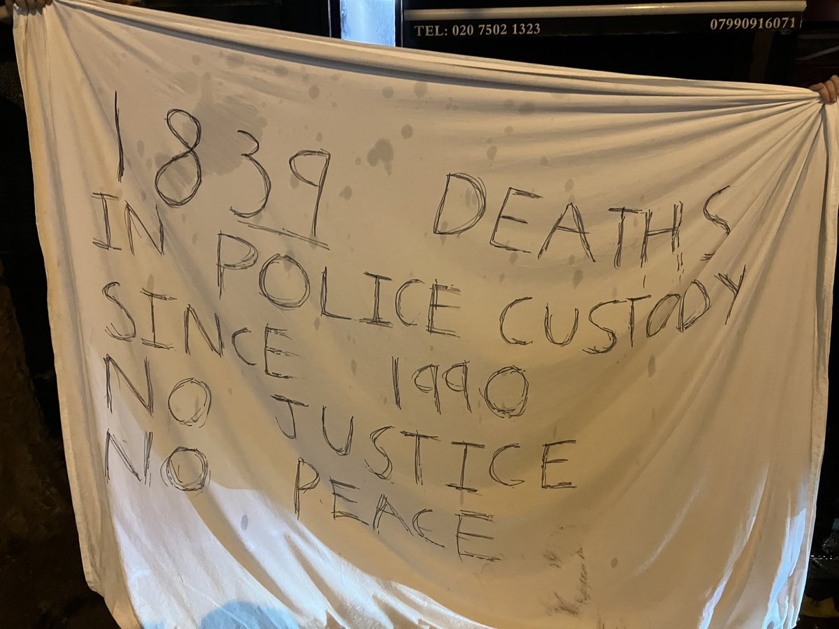 Copwatch and members of the public are outside Stoke Newington Police Station after someone was killed inside earlier this evening