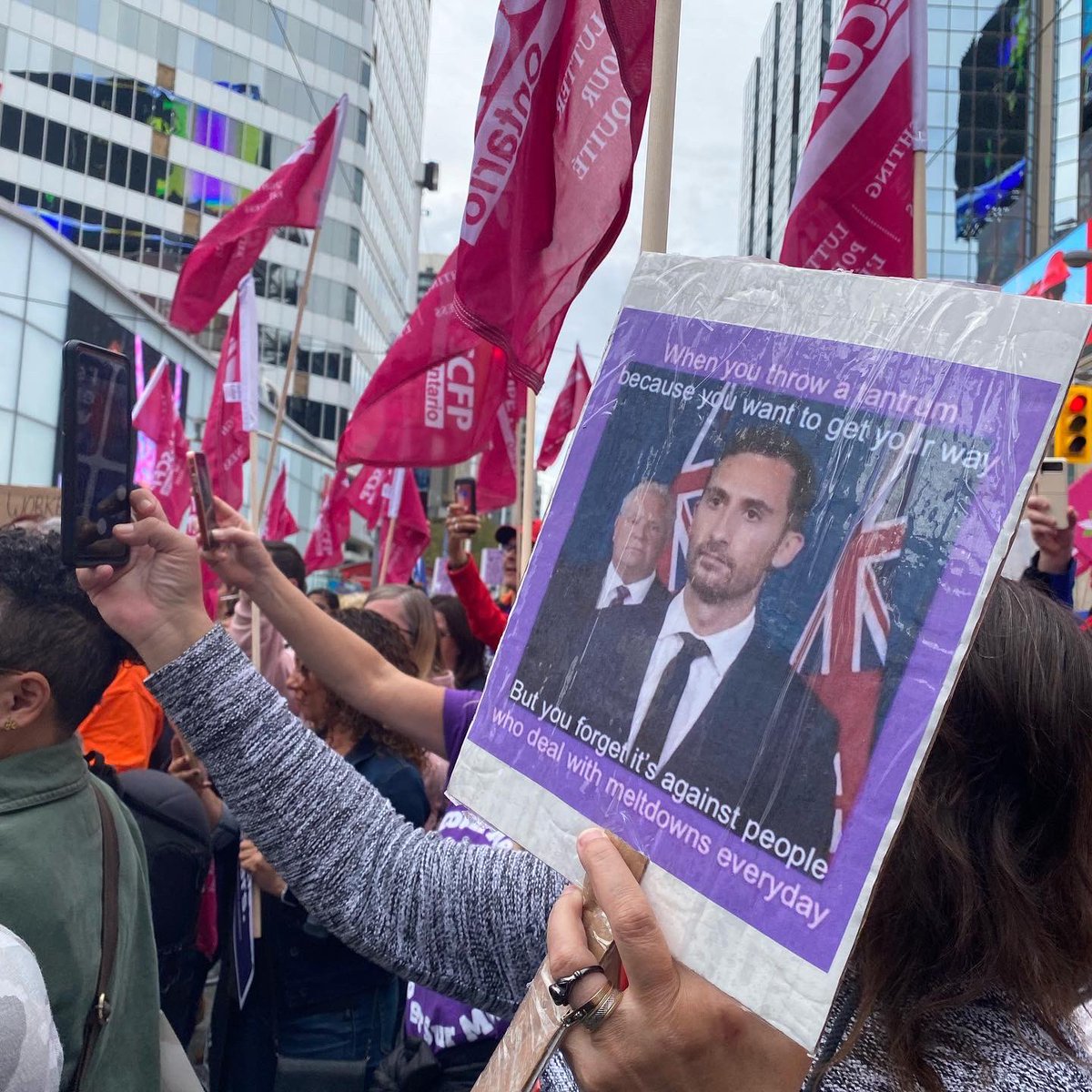 MaritStiles's tweet photo. Huge crowd at Yonge &amp; Dundas Square today in solidarity with @osbcucscso @CUPEOntario members! Find out about upcoming solidarity actions near you: https://t.co/kIQtldJZWz #IStandWithCUPE #onpoli #onted https://t.co/djFazwfa1N