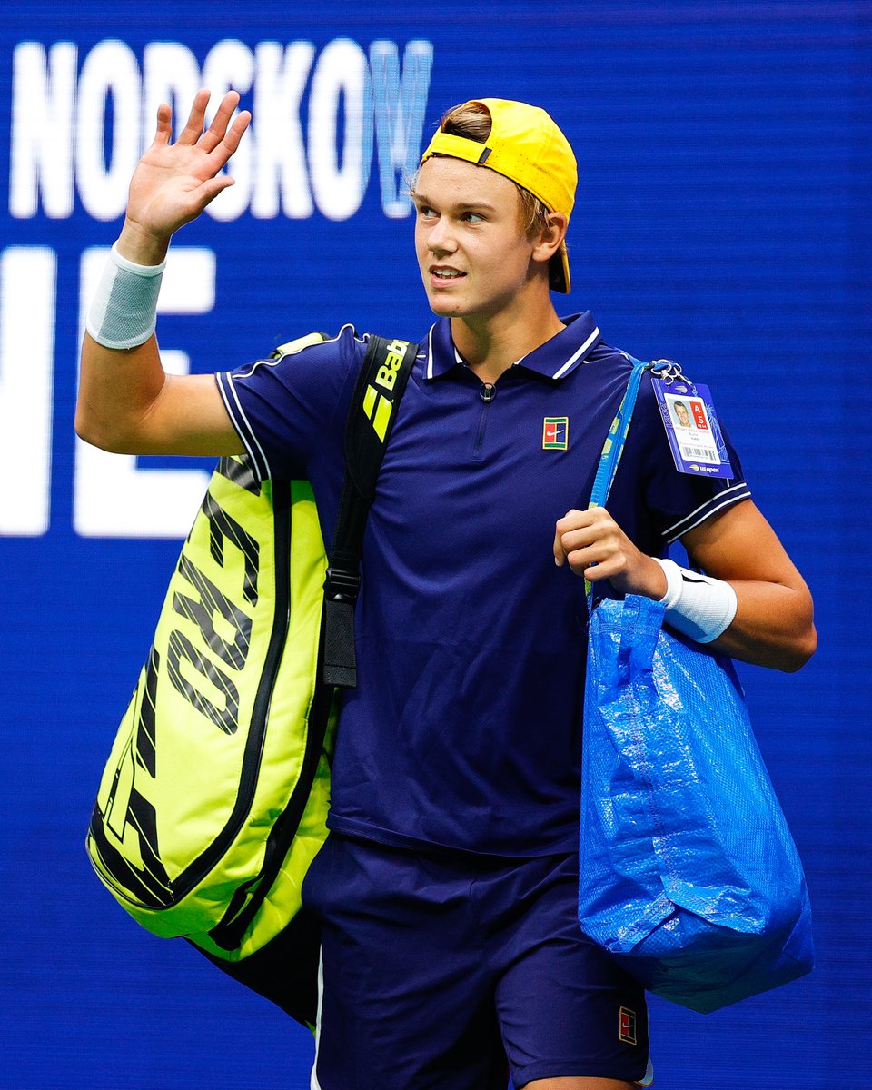 MouratoglouAcad's tweet photo. The man with the IKEA bag 💙💛
14 months ago, a fresh-faced @holgerrune2003 introduced himself to the world against Djokovic... https://t.co/w97xQ5wqT1
