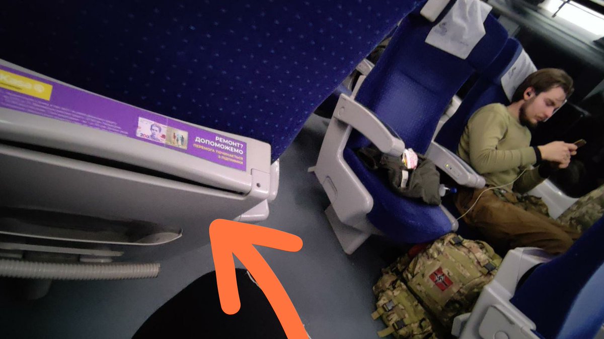 Last photo for tonight:
This is a *third* photo that the soldier took on the train to Kyiv.

Notice that this is a #Ukrainian train.

The soldier has a #NAZI symbol on his bag.

It wasn't photoshopped.

You can see this guy's face. He's unfortunately real.