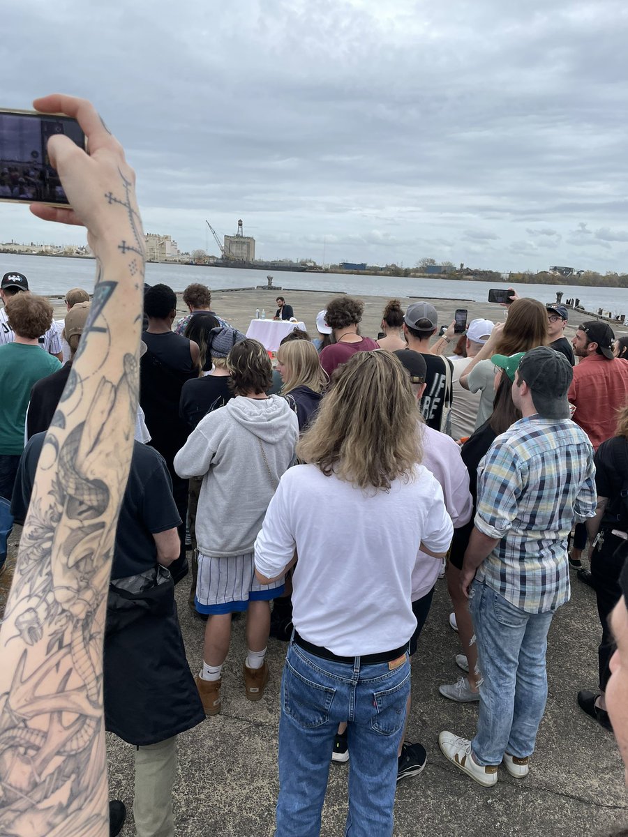 a large crowd of people gathering and watching a stranger eat a whole rotisserie chicken ? i love philly.