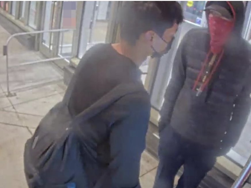 NEW: Calgary Police have released this CCTV shot of the victim and the person of interest in the East Village fatal assault on Tuesday. The unidentified victim is on the left, person of interest in the red bandana on the right. #yyc