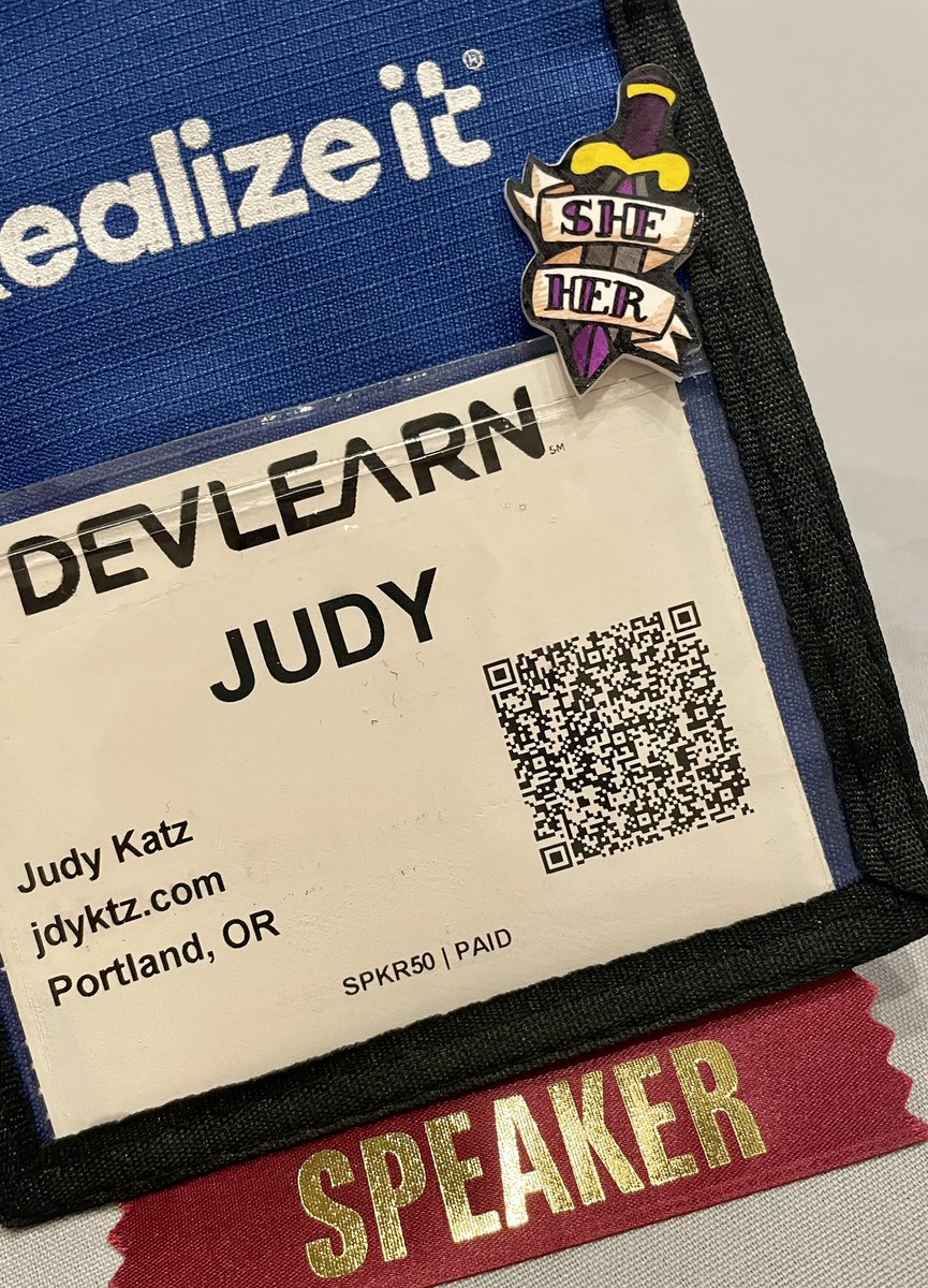 I just lost one of my pieces of flair between the main entrance and the expo hall! 😭 I love seeing how ppl add pins/stickers/ribbons to badges to express themselves at shows... show me your flair? #DevLearn #DevLearnFlair