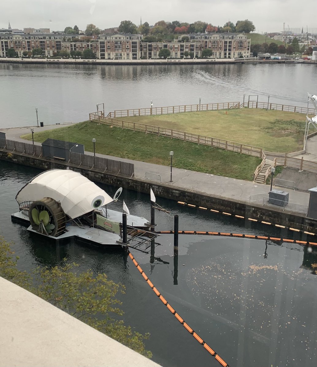 Cool to see <a href="/MrTrashWheel/">Mr. Trash Wheel</a> just out the window of #NAF2022! The trash interceptor uses solar and hydro power to remove hundreds of tons of trash from the river each year!