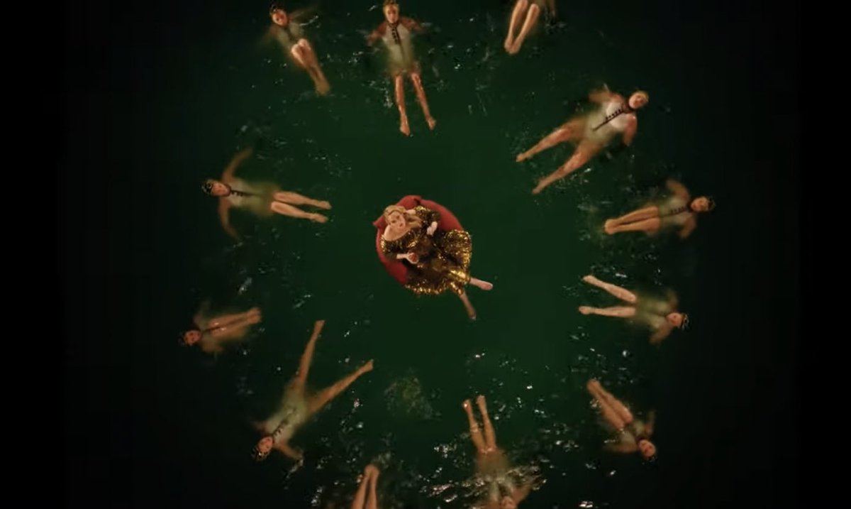 Adele has finally moved on from sitting on chairs to floating on tubes 😍 #IDrinkWine