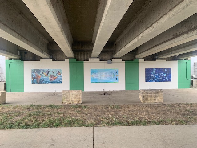 Enjoy the fall weather by visiting the new art panels now up under the Main Street bridge in #CedarFalls. Each panel features work from a local #Iowa artist: (L-R) Caylin Jayde; Karin Desnoyers; Autumn Rozario Hall. Plan your next CF trail walk and see them! #ThisIsCedarFalls