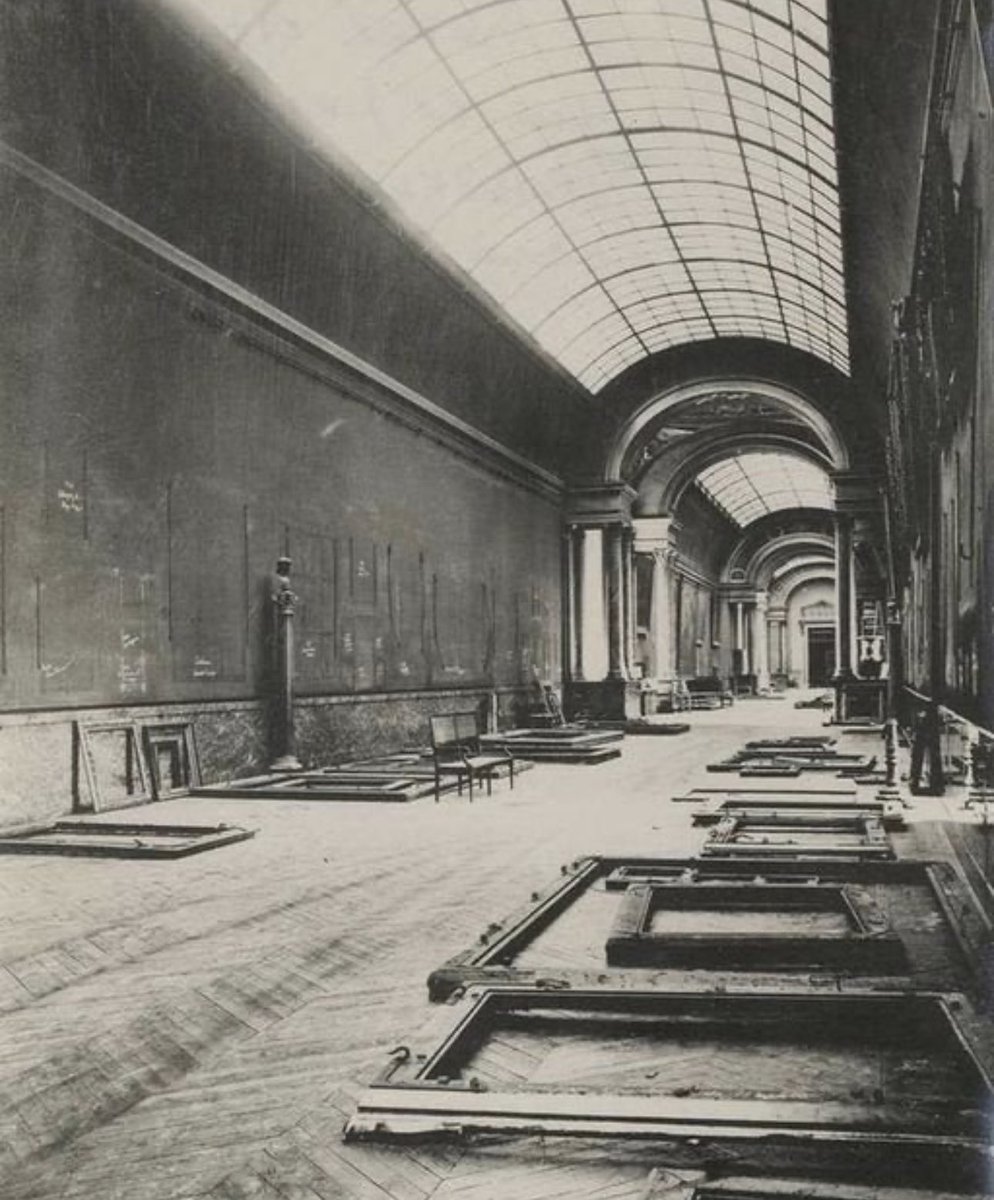 The Grande Gallerie in the Lourve Museum in Paris, France in 1939. Paintings on the walls had been removed in anticipation of the outbreak of World War II. The walls were inscribed with the names of the paintings so they would be able to put them back.