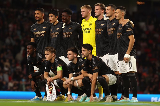 The Arsenal team line up for a pre-match photo before taking on PSV in Eindhoven