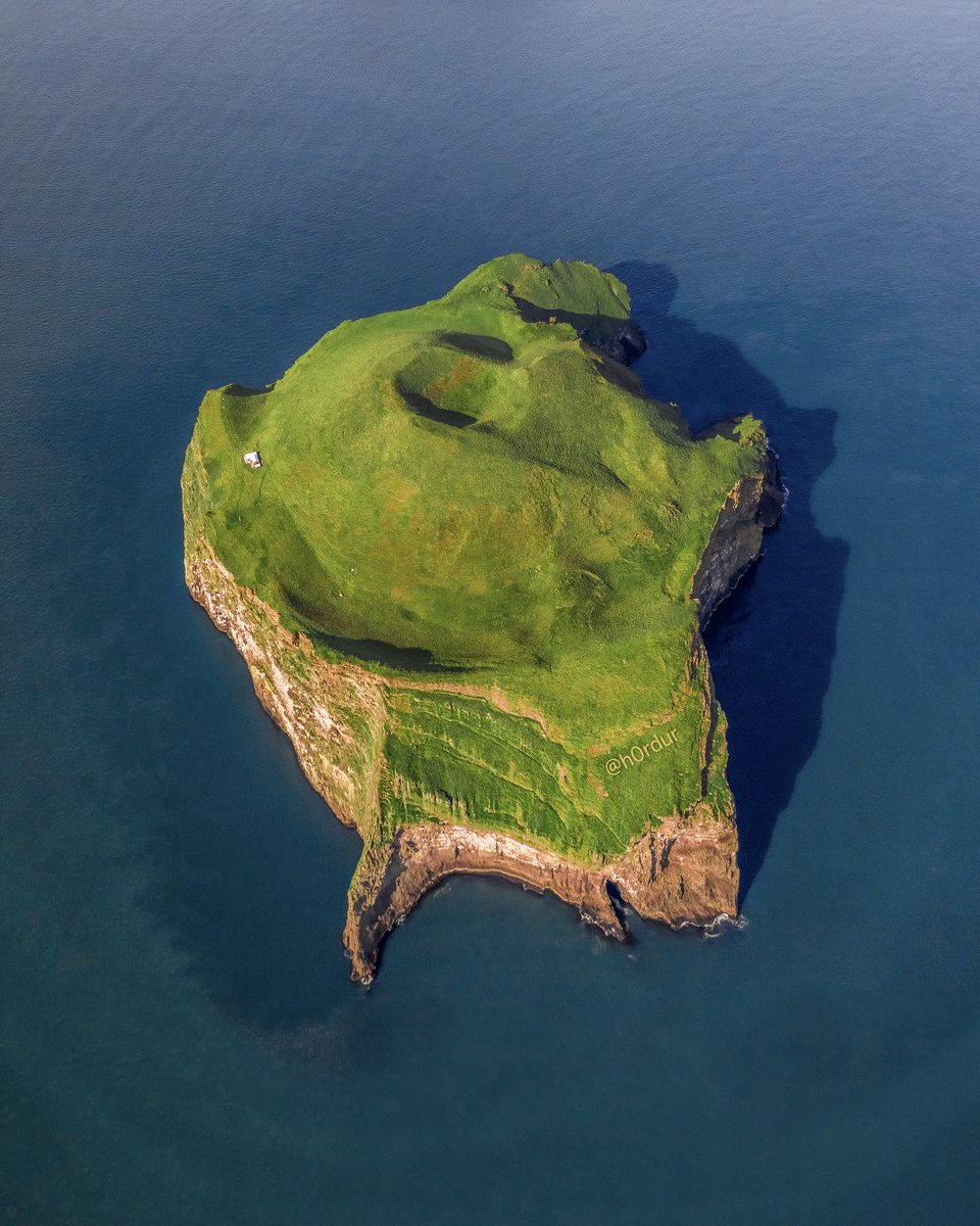 House on an ancient volcanic crater in the middle of the ocean. Would you live there? 🏠 #iceland