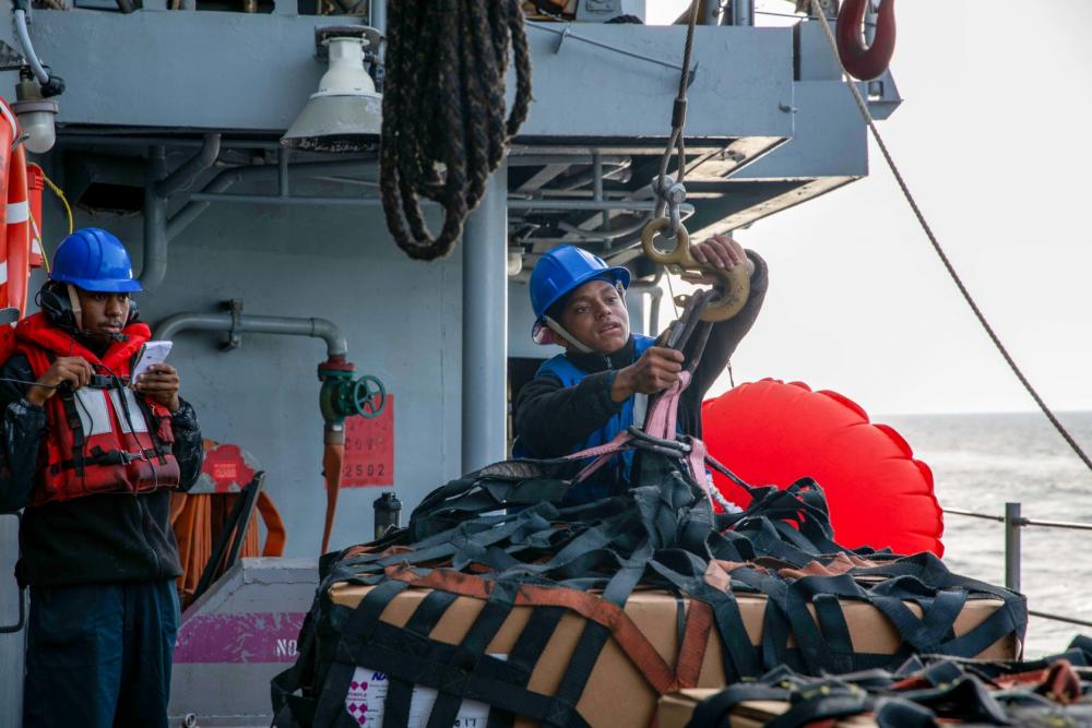 mapleleafnavy's tweet photo. Deployed with the Gerald R. Ford Carrier Strike Group, USS Ramage #DDG61 Sailors handle line during a replenishment-at-sea with the Royal Canadian supply ship MV Asterix. US Navy photos. https://t.co/azEdLnJhpn