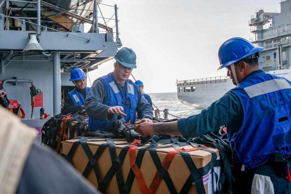 mapleleafnavy's tweet photo. Deployed with the Gerald R. Ford Carrier Strike Group, USS Ramage #DDG61 Sailors handle line during a replenishment-at-sea with the Royal Canadian supply ship MV Asterix. US Navy photos. https://t.co/azEdLnJhpn