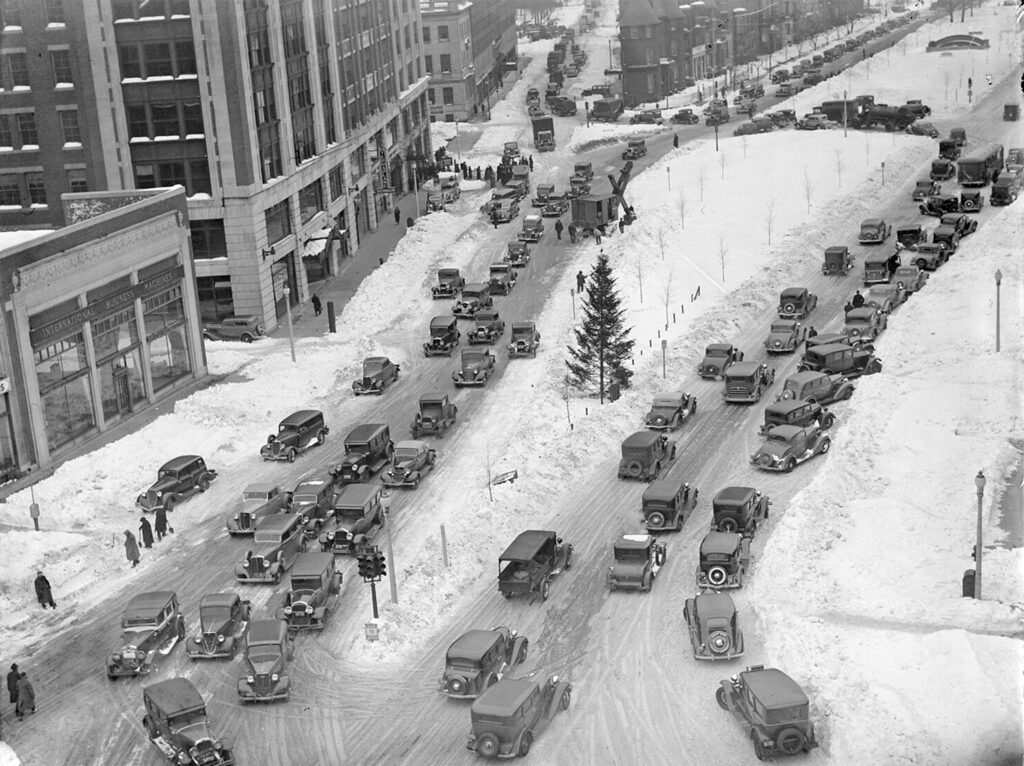 There are a couple of reasons why American cities are more auto-dependent than peer metros around the world, but a big part of it is we had just so many cars so early on, and they soon dominated every street and road. Kenmore Square in Boston, MA Circa 1935