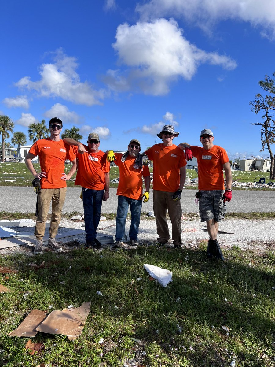 Michael48706's tweet photo. Team rubicon meet team Depot, about 150 Orange shirts.  First bus of many volunteers.#Ian hurricane #teamdepot https://t.co/uThnjFwL3y