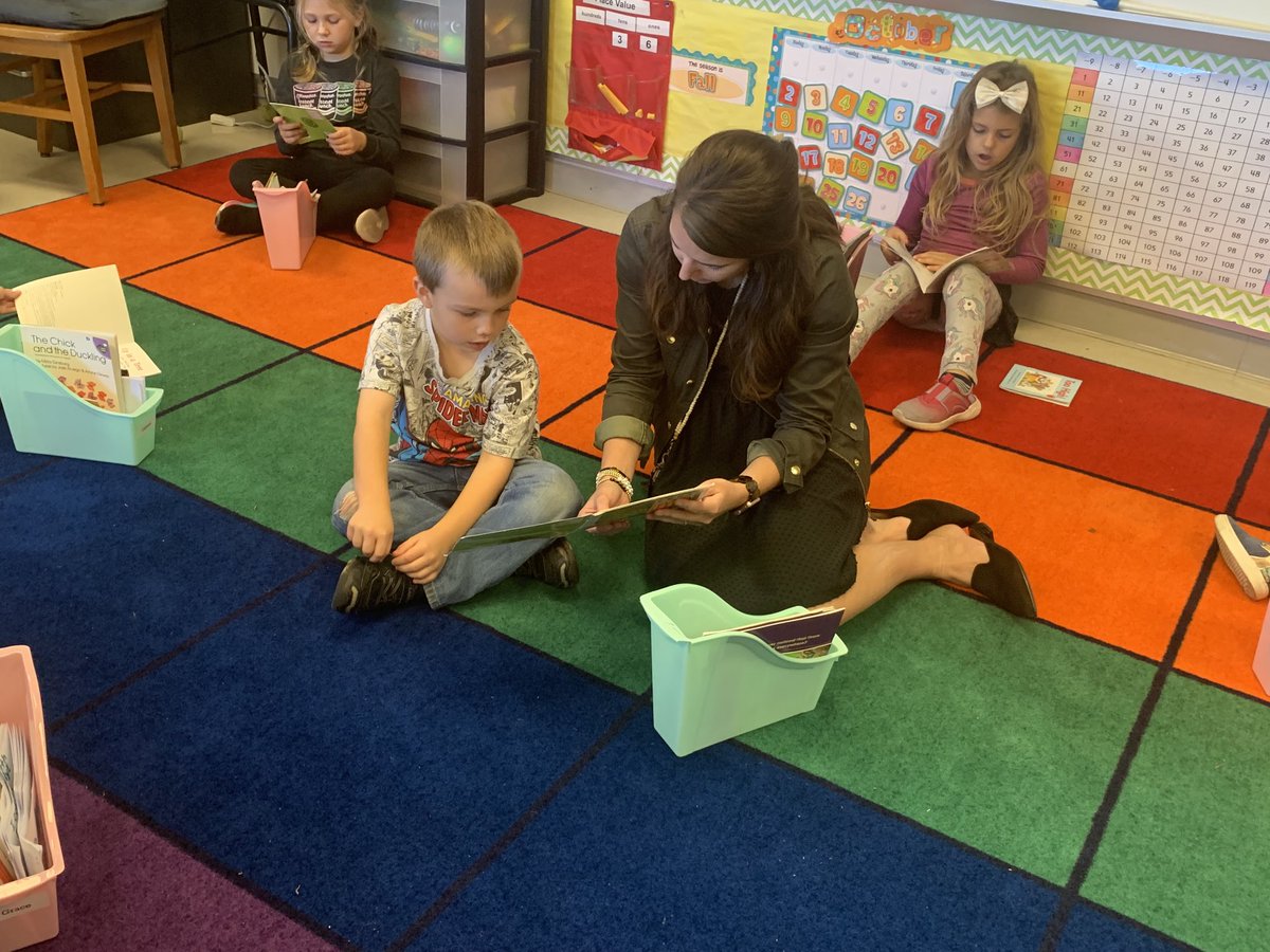 Mrs. Longstreet is working with a soon-to-be word detective during independent practice time.