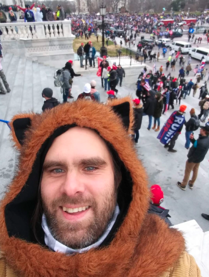 This guy in the bear hoodie is Macsen Rutledge. Yes, he stormed the Capitol. He was arrested in Lansing NY today. Congratulations to all of us - he's the 900th person arrested for Jan 6th. Let's get it to 1000 soon.