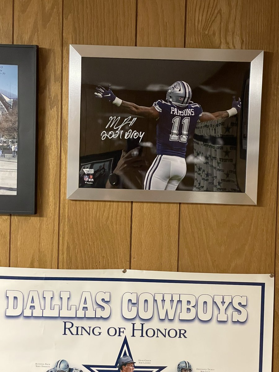 CowboyzNation's tweet photo. Big shoutout to @mtag1993 @JimmyDee4444 and #TagNation for this sweet @MicahhParsons11 signed 2021 DROY photo. Looking good in the #cowboyscave .  Check them out if you don’t already. https://t.co/Plwg1BciYt