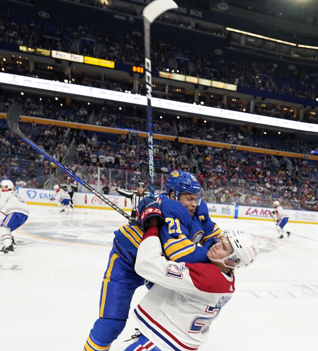 #Sabres captain Kyle Okposo checks #Canadiens Kaiden Guhle during the second period.