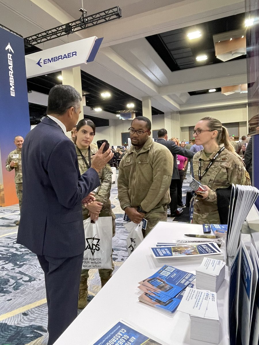 AFCLC's tweet photo. The @AirliftTanker Symposium kicked off with a reception with exhibitors Thursday evening and Dr. Daniel Uribe and @LoriMQuillerAPR are on site! If you’re at the symposium, stop by the @HQAirUniversity booth for a chat and demo of the @AFCLC  #CultureGuide app. #WeAreAFCLC #ATA22 https://t.co/gIsBwOool3