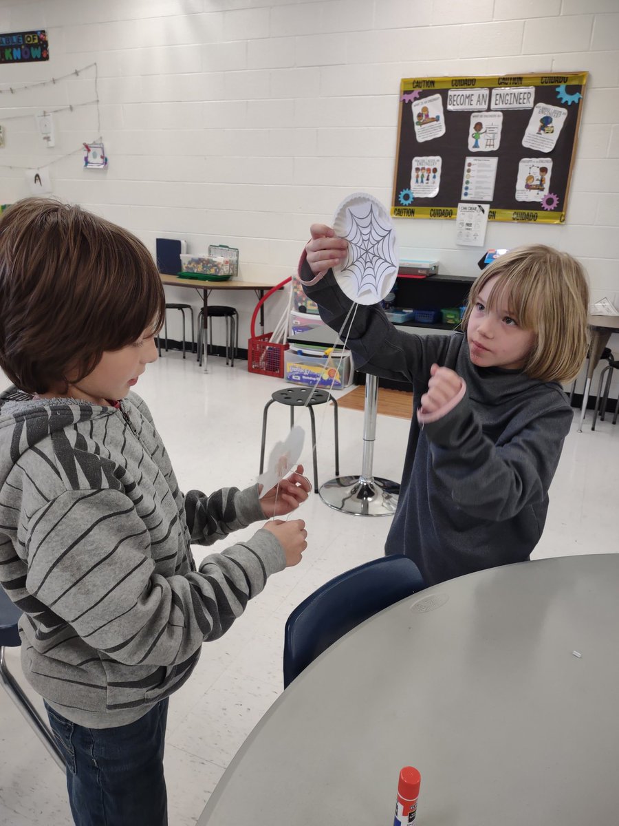 DesTeam's tweet photo. Check out our DES 3rd graders making spider pulleys! We learned about simple machines and how pulleys work. Then they made a pulley that help them get their spider up to it's web! They had a lot of fun with this STEM! 🕷️ 🕸️ 🎃 I love spooky season! https://t.co/VILsefN1tT