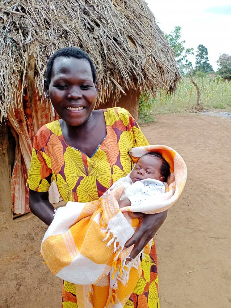 Juliet happily holds her daughter. Her labor pains began at 9 pm. She was rushed to a HC &amp; found out that she required specialized care, but couldn't afford to get to Mbale RRH. Bulamu’s ET coordinator paid for her to be driven 29 kms to where her baby was safely delivered.