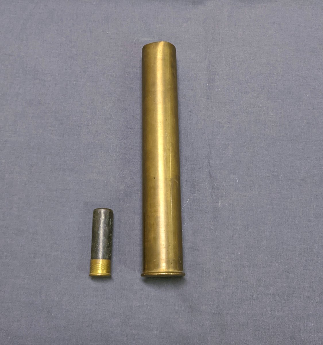 The term punt gun is sometimes used for any large shotgun, but it is a class unto itself. The spent casing on the right was made by Greener who also made punt guns for market hunting waterfowl. The paper hull 12 gauge on the left is for scale.