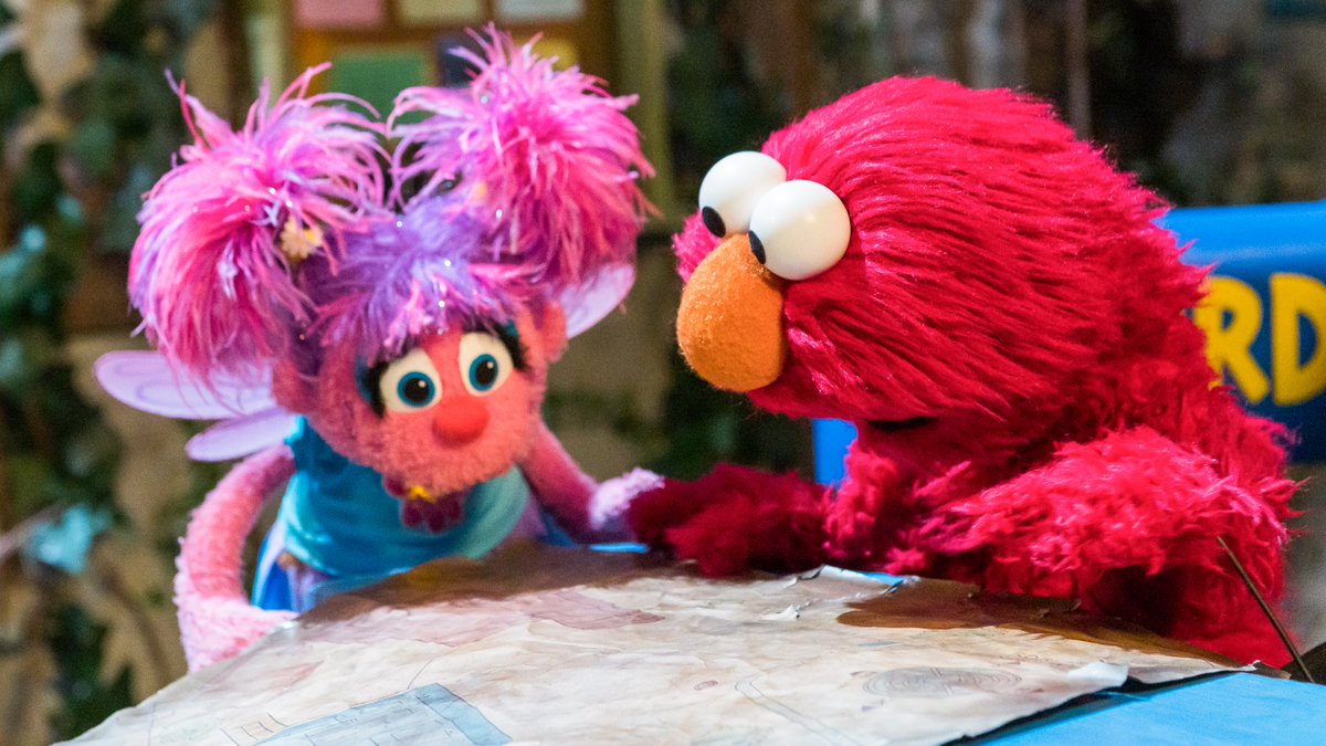 elmo's tweet image. Elmo and @AbbyCadabbySST are using a map so we can go trick or treating at every apartment on Sesame Street! Happy #Halloween!