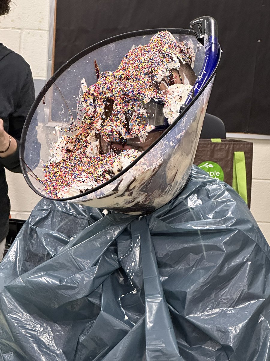 In case you ever wondered what a human ice cream sundae looks like 🍨, we give you the highlight of the week @HopewellPride! Mr. Rouff took one for the team when his 8th graders fell to the 7th graders in #LakotaStufftheBus this year! #WEareLakota #nationalprincipalsmonth