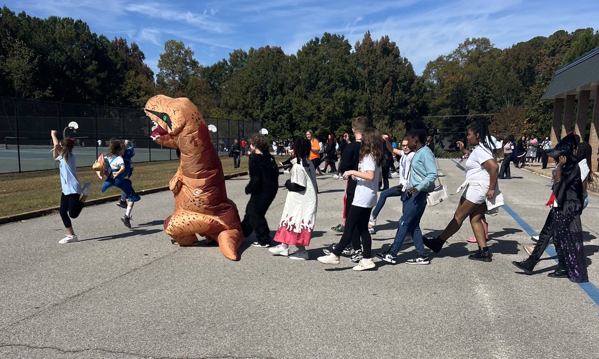 wright4kiddos's tweet photo. Wait- is that a TRex in the @CRISCougars dance off at the Fall Fest? https://t.co/oUw1mTzqna