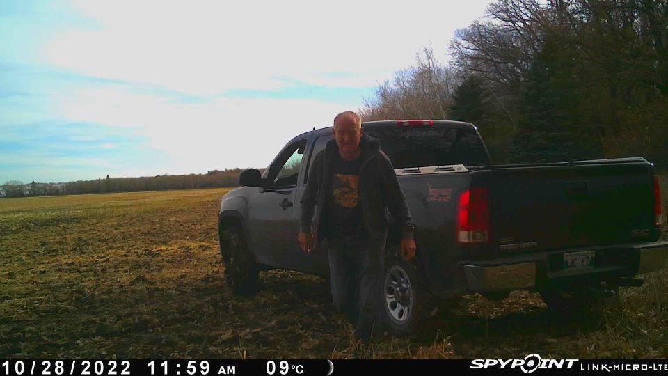 This guy drives 1/4 mile across my field to the corner where a trail cam is set up, takes the AA batteries out of it and leaves. I have no idea who he is or what he wants.
