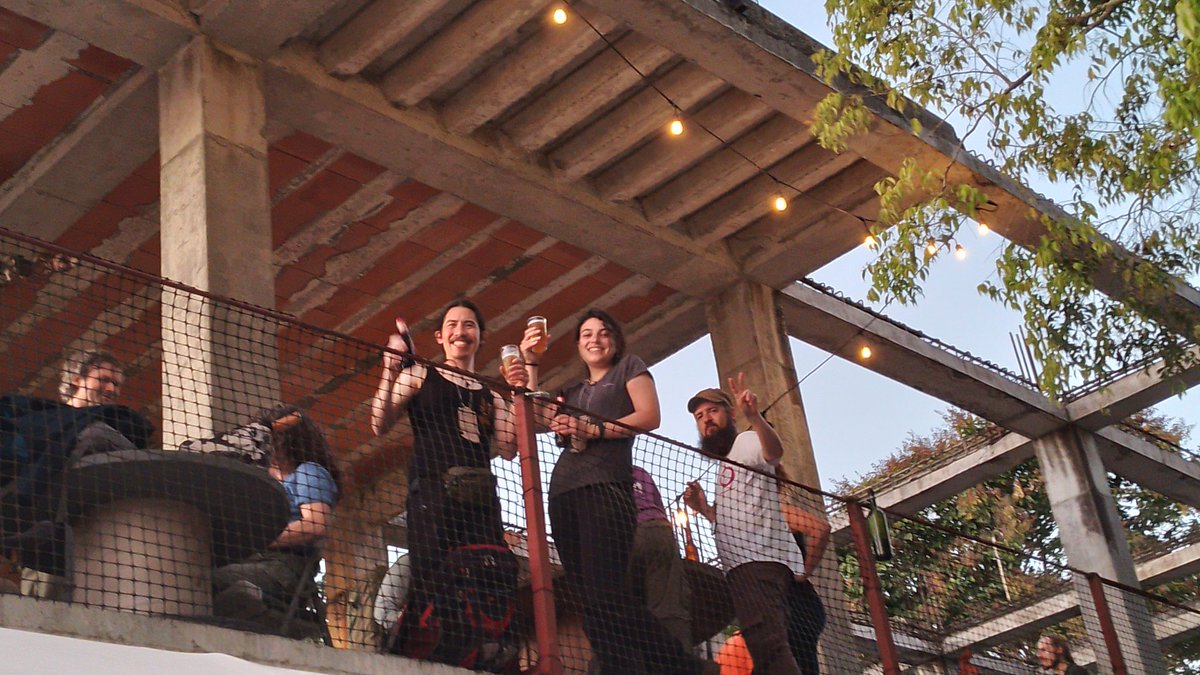 GOSHCommunity's tweet photo. Party, at last! 
Nothing to see here, just some goshers chilling at sunset, looking at the Panama Canal with a drink in their hands #GOSH2022
(in fairly unusual weather for the panamanian winter) https://t.co/OKfqYnam8c
