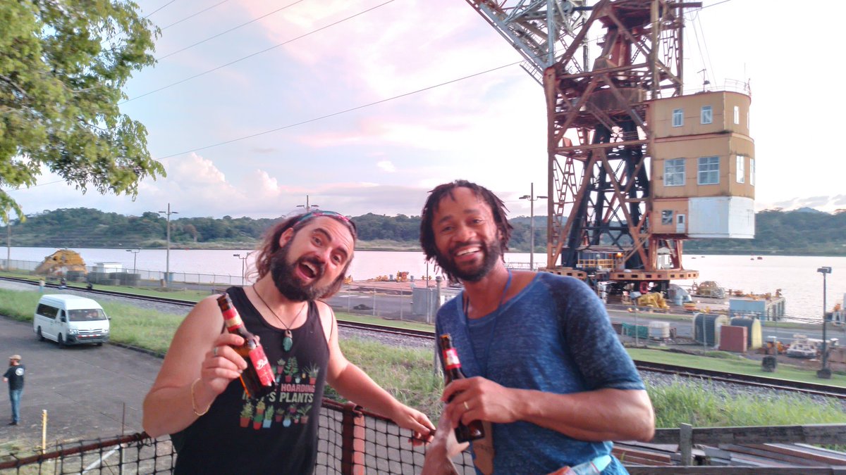 GOSHCommunity's tweet photo. Party, at last! 
Nothing to see here, just some goshers chilling at sunset, looking at the Panama Canal with a drink in their hands #GOSH2022
(in fairly unusual weather for the panamanian winter) https://t.co/OKfqYnam8c