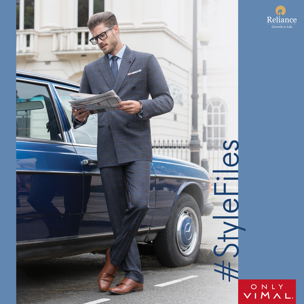 OnlyVimal_India's tweet photo. Get ready to make headlines in this ensemble! In the frame, is a model wearing a two-piece double breasted grey and blue checkered suit with a blue and white checkered shirt. #OnlyVimal #StyleFiles
#Reliance #RelianceIndustries https://t.co/TogX3lr1PK