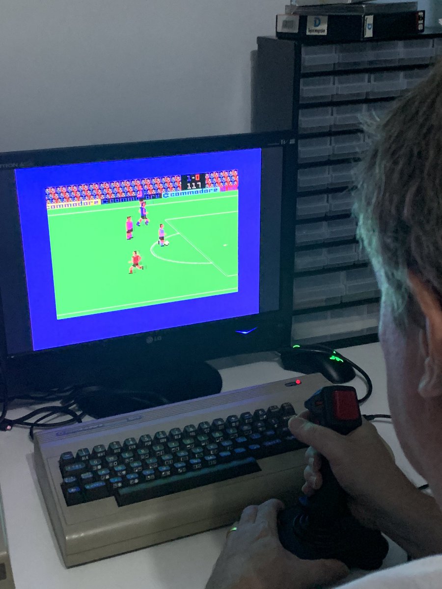 MarlCityDev's tweet photo. Playtime. @SleepyGXL caught me while playing โInternational Soccerโ . He said it looked way better than FIFA. ๐๐ #C64 #Conmodore #retrogaming #retrogames #8bit #retrogamer #RetroComputing https://t.co/fxYAcVWkkx