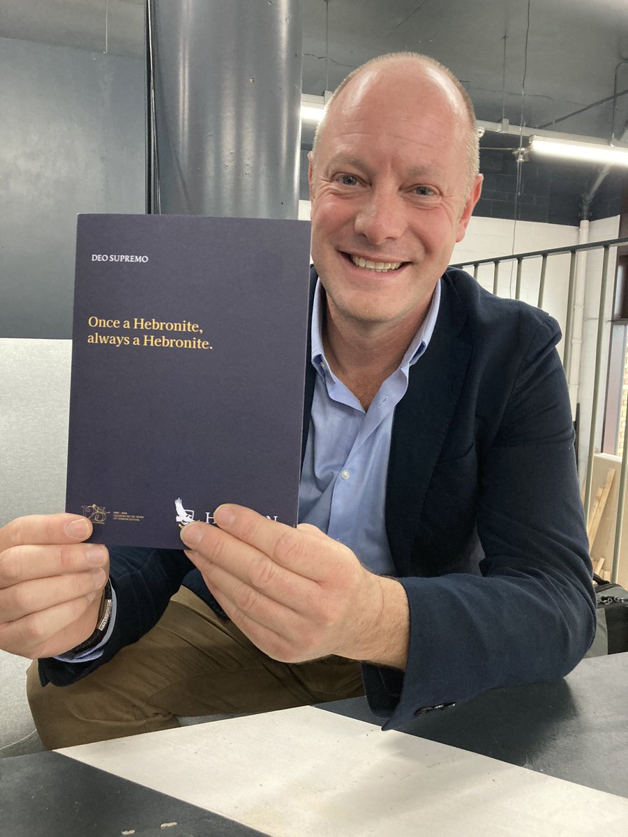 Getting ready for the Hebron reunion 2022 in London - Henry White, new website designer, with the folder for today’s 150 guests.
