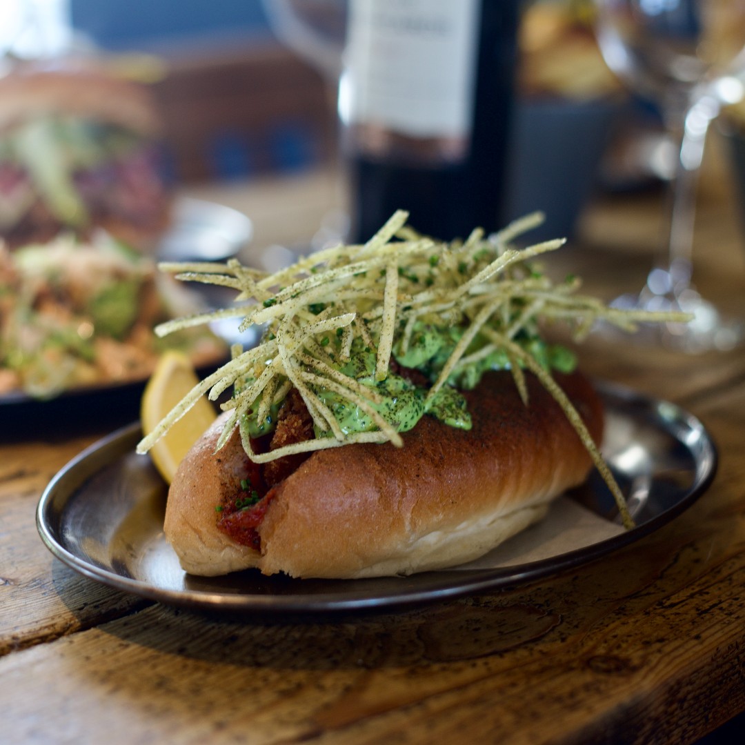 Our crispy pollock dog is fast becoming the stuff of legend! Served with smoked tomato sauce, leek top tartare, iceberg and nori crisps, and sandwiched between a <a href="/DaBaraBakery/">Da Bara</a> potato bun. 

#fishdog #cornishfish #eatlocal #smokehouse #cornwallfood