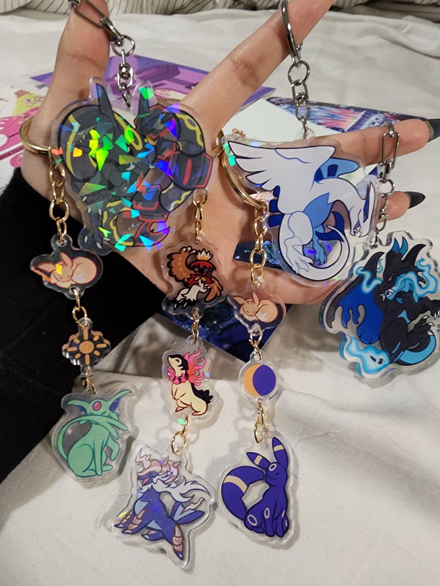 nShaydii's tweet photo. met the amazing @chai_bean today at the Super Effective concert and needless to say i splurged a little .. 

absolutely in love with her evolution line charms !! and she was nice enough to us the rowlet print for free because she ran out of the charm version 🥹🥹 https://t.co/vG8vkAWcyw